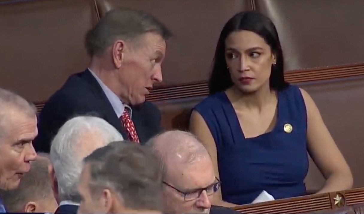 Reps. Alexandria Ocasio-Cortez and Paul Gosar, deep in conversation