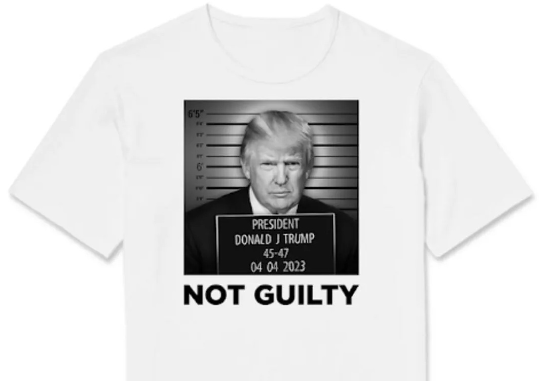 Not Guilty t-shirt; it has a picture of The Donald
and his perp card says President Donald J. Trump, 45-47, 04-04-2023