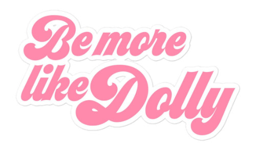 It says 'Be More Like Dolly'
in a script font rendered in pink