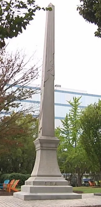 A four-sided obelisk, in
front of the Decatur Court House, about 30 feet tall