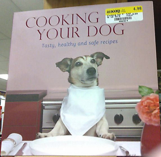 It is a cookbook
clearly titled 'Cooking for Your Dog.' However, the price tag covers the word 'Your' such that it looks like 
'Cooking Your Dog.'