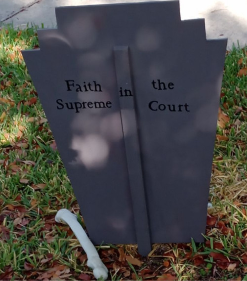 The fake tombstone reads
'Faith in the Supreme Court