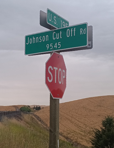 A sign for Johnson Cut Off Road