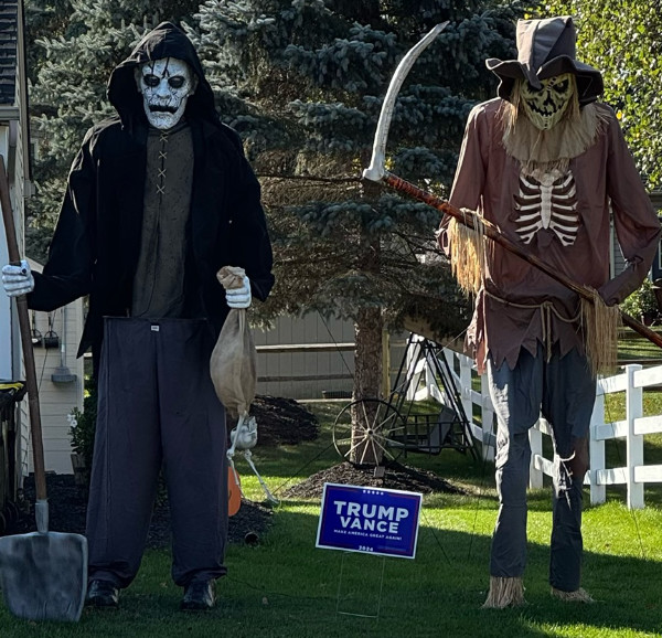 A full-sized zombie and ghoul, and in between them a Trump-Vance sign