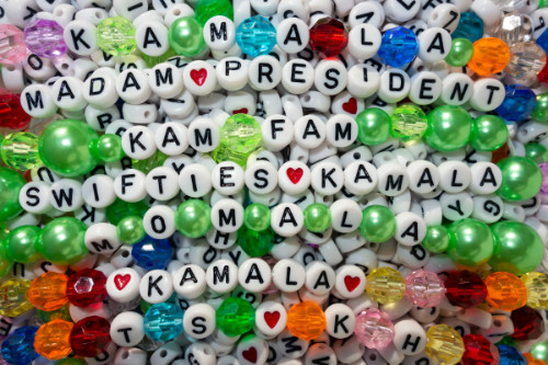 A collection
of friendship bracelets that say things like 'Ms. President,' 'Swifties Love Kamala' and 'Momala'