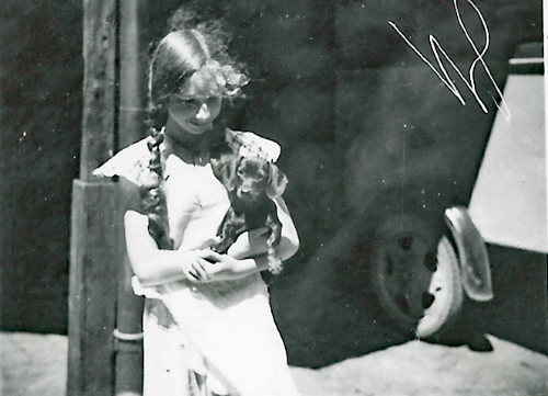 A 1930s picture of a girl with a dachshund