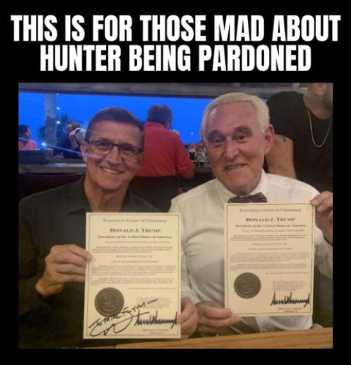 Mike Flynn and Roger Stone
pose for a picture with their Trump-signed pardons