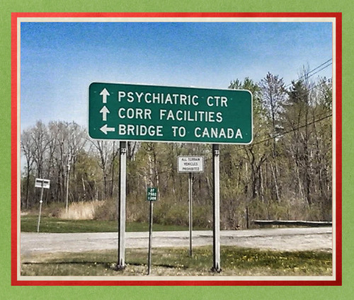 A sign that points
the way to a prison, a mental institution and the Canadian border