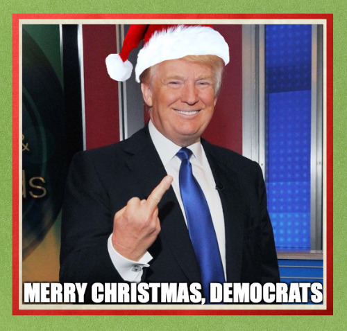 Trump 
making an obscene gesture, along with the caption 'Merry Christmas, Democrats!'