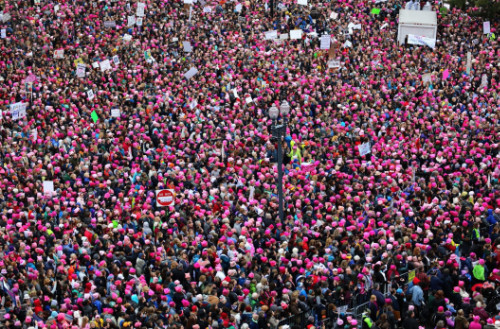 An overhead view of a massive women's march
where most participants are wearing pink. At least 300-400 people are visible, and they spill over all four frames of the image, so
there were clearly far more than that.