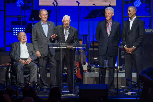 From left to right, Bush Sr. in a wheelchair,
Bush Jr., Carter, Clinton and Obama